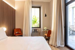 Кровать или кровати в номере Binario 934 Boutique Hotel