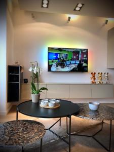 Телевизор и/или развлекательный центр в Appartement Sunny home Deluxe
