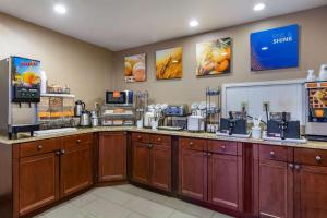 a coffee shop with a counter with machines on it at Comfort Inn & Suites in Staunton