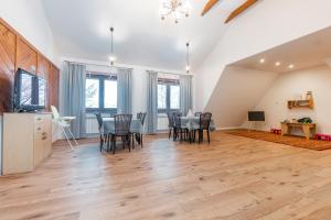 a large living room with a table and chairs at 9 Sił Drewniany Dom in Bukowina Tatrzańska