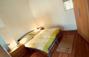 a bedroom with a bed in a room at Apartman Mijo 1 in Jadranovo