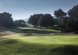 a view of a golf course with a green at Casa de Cristal - Beautiful villa with private pool, 350m from beach, astonishing views in Mar de Cristal