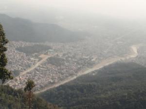 a view of a city from the top of a mountain at Madhukunda Homestay in Butwāl