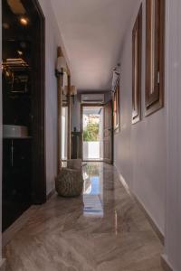 an empty hallway with a large hallway with a hallway at Archo Suites Pythagoreio in Pythagoreio