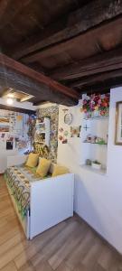 a bedroom with a white bed with yellow pillows at Stella di Rio 5 terre riomaggiore in Riomaggiore +29 photos