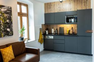 Kuchyň nebo kuchyňský kout v ubytování Design Studio - WIFI und NETFLIX