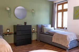 Postel nebo postele na pokoji v ubytování Design Studio - WIFI und NETFLIX