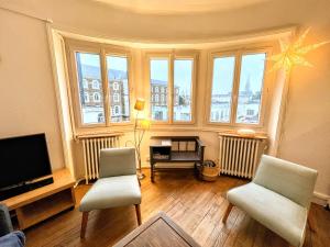 Ruang duduk di Appartement de Charme de 75m², Lumineux et Calme