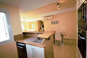A kitchen or kitchenette at Villa Lovisi