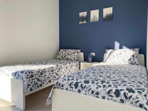 Postel nebo postele na pokoji v ubytování Happy Guest Apartments - Blue Apartment