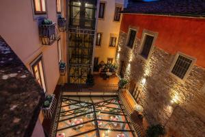 an overhead view of a building with a balcony at Hotel Alba Palace in Florence