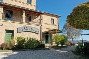 a building with a sign that reads la ville morgue at La Vita Nuova in Morro dʼAlba