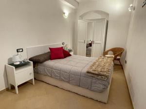 Postel nebo postele na pokoji v ubytování La loggia di Nà