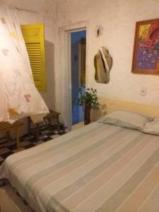 Postel nebo postele na pokoji v ubytování Casa de praia rústica