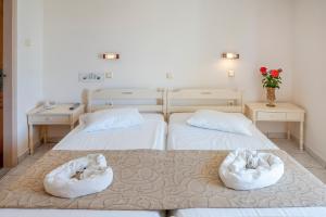 Ένα ή περισσότερα κρεβάτια σε δωμάτιο στο Ξενοδοχείο Κοάλα