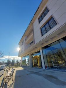 a store front with benches in front of a building at İpsala Park Hotel in İpsala