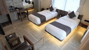 De Glance Hotel, Near Surat Railway Station客房内的一张或多张床位