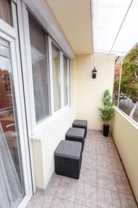 Posezení v ubytování Flame Luxus Apartman