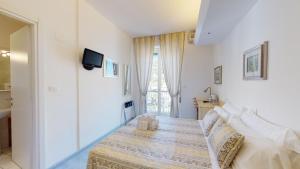 Posteľ alebo postele v izbe v ubytovaní Hotel Ligure