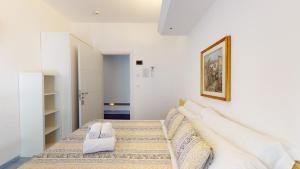 Posteľ alebo postele v izbe v ubytovaní Hotel Ligure
