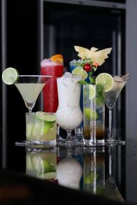 a group of cocktails on a glass table at M2 Hotel Waterside in Phayao