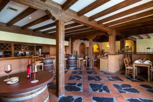 a tasting room with barrels and a bar with wine glasses at Hotel LIVVO Volcán Lanzarote in Playa Blanca