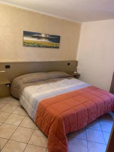 Postel nebo postele na pokoji v ubytování Borgo Piccolo