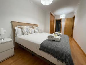 A bed or beds in a room at OKTHEWAY Castelao Street