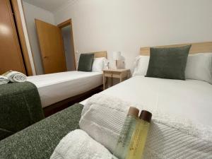 A bed or beds in a room at OKTHEWAY Castelao Street