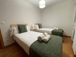 A bed or beds in a room at OKTHEWAY Castelao Street