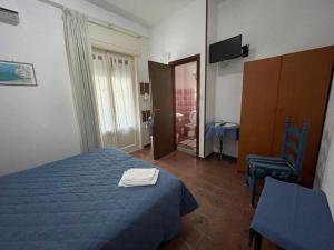 Postel nebo postele na pokoji v ubytování Hotel Europa