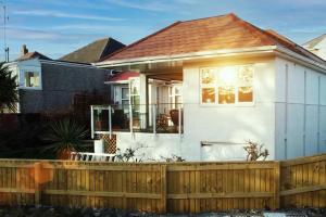 a house with a wooden fence in front of it at Maldon - A Family house in South Devon in Plymouth