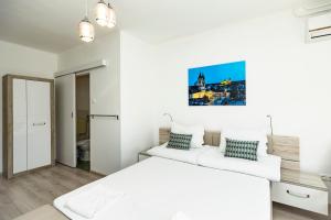 Posteľ alebo postele v izbe v ubytovaní Dobó Vendégház