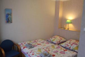 Postel nebo postele na pokoji v ubytování Ferienwohnung am Sonnenhügel mit Terrasse