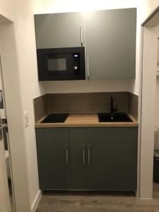 Køkken eller tekøkken på Tiny Apartment Bad Harzburg Leihfahrräder gratis Shuttleservice