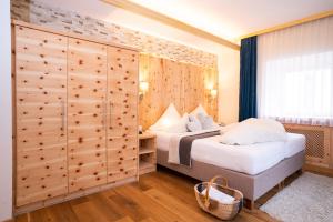 Łóżko lub łóżka w pokoju w obiekcie Beauty & Wellness Hotel Tirolerhof