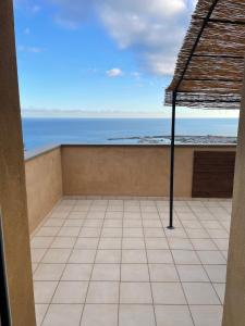 a balcony with a view of the ocean at Agriturismo "I Castellari" in Pietra Ligure