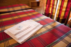 A bed or beds in a room at Hotel La Piazzetta