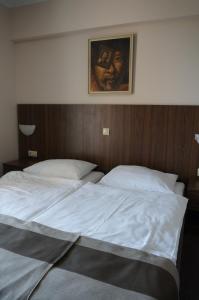 מיטה או מיטות בחדר ב-VILLA VOLOSKO with private parking and breakfast,seaview