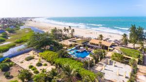 an aerial view of a resort with a beach at Aimberê Eco Resort Hotel in Coqueiro +37 photos