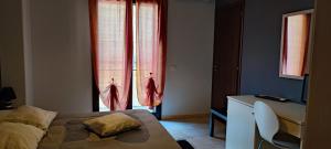 Postel nebo postele na pokoji v ubytování B&B LAVIKA PEDARA