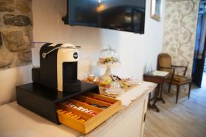 a coffee maker sitting on top of a counter at Antiche Mura in Tivoli