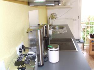 a kitchen counter with a coffee maker on a counter top at Ferienwohnung Hochwald - im Herzen des Saarlandes in Quierschied