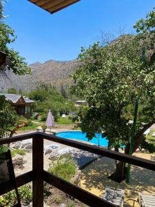 a view of the pool from the balcony of a house at Refugio del Maipo Lodge in San José de Maipo