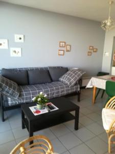 a living room with a couch and a table at Westend Palace in Westende
