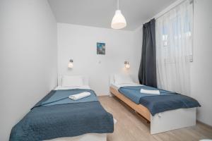 a bedroom with two beds and a window at Wonderhouse SOVLJA in Tribunj +35 photos