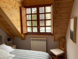 Postel nebo postele na pokoji v ubytování Eth Céu de Salardú