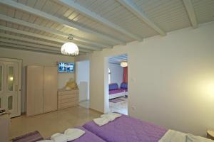 Cama ou camas em um quarto em Mykonos Marina