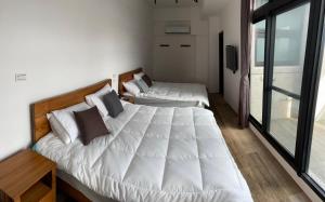 Postel nebo postele na pokoji v ubytování Bondi Homestay