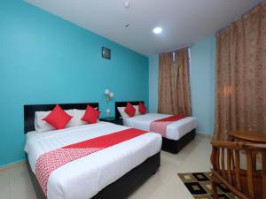 Un ou plusieurs lits dans un hébergement de l'établissement Marjan Hotel Sdn Bhd